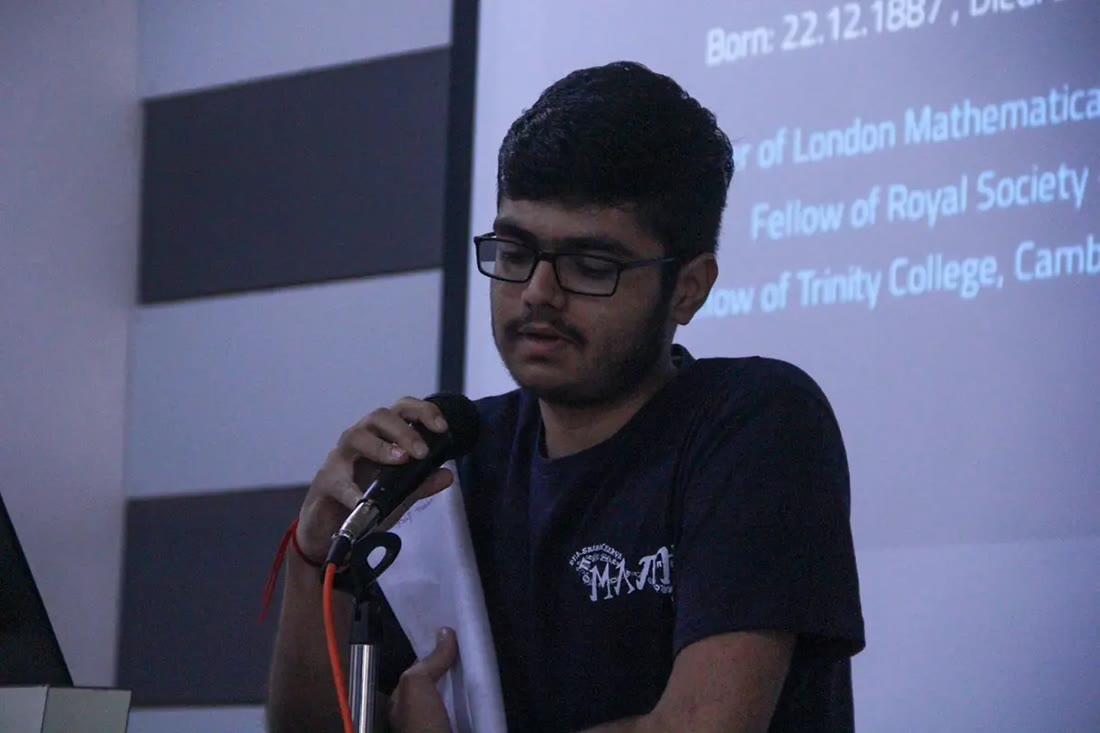 A club member speaking at the GATE Mathematics lecture wearing the member t-shirt